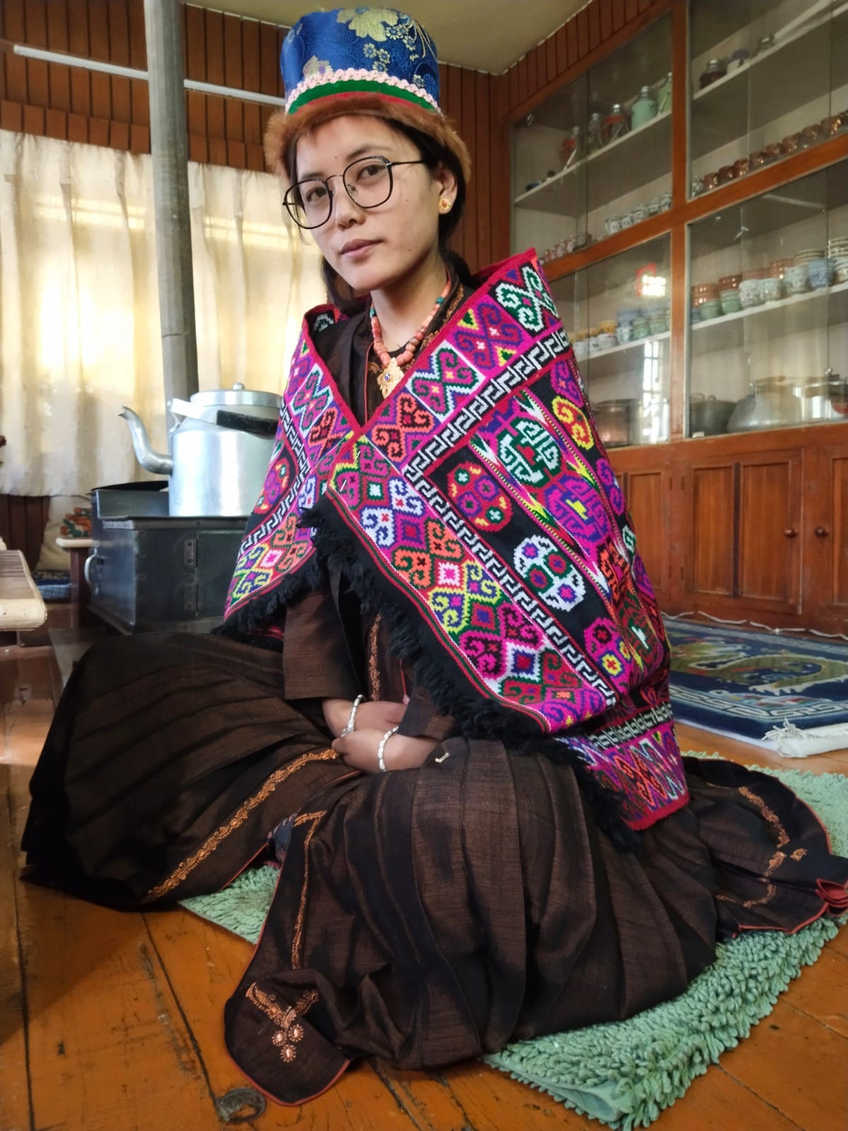 Spitian bride wearing Lingzey (multi colored shawl) Lokpa (thick hand strewn green cloak) Sulma (brown gown ) and Tiwi (hat)